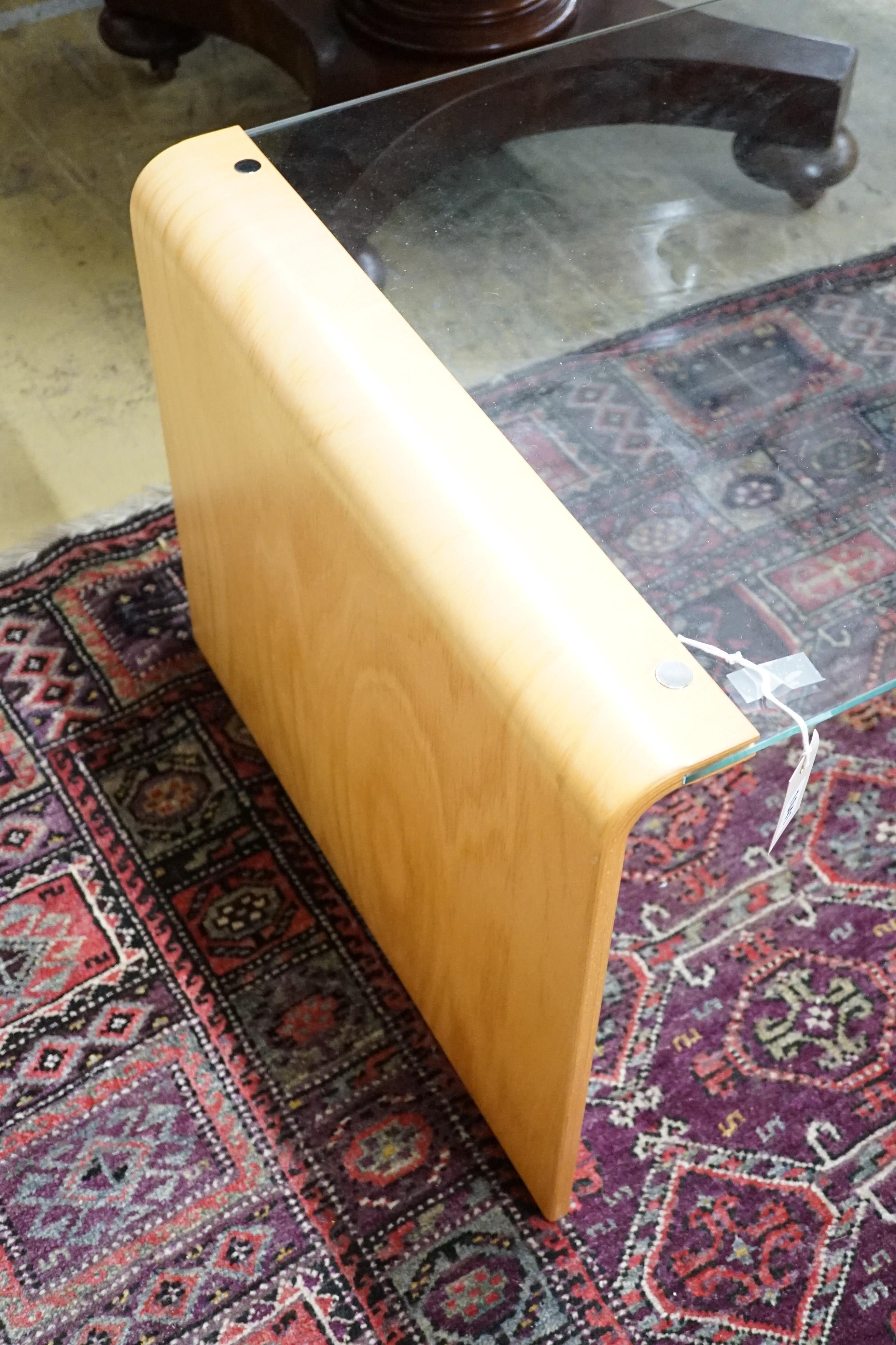A modern glass and bentwood coffee table, length 128cm, depth 60cm, height 47cm
